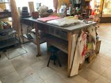 a kitchen island with a wooden table in the middle of the room