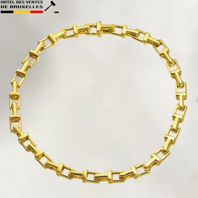 an image of a gold bracelet on a white background