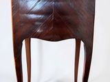 an image of a small wooden table with a chevroned top