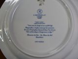 a plate with a poem written on it on a table
