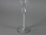 an image of a clear glass candle holder on a table