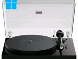 the turntable is black and has a clear cover on it