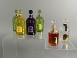 a clear table with bottles of liquor on it