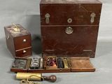 a small wooden box with several items inside of it