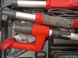 two wrenches and a clamp in a tool box