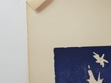 a picture of a blue and white picture on a wall