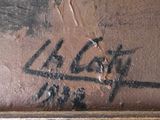 graffiti on the wall of a bathroom with a toilet in it