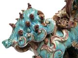 a statue of a dog with a hat on it ' s head