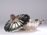 silver plated bowl with lid and flower decoration on it