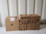 several cardboard boxes stacked on top of each other on a table