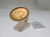 l'image d'un anneau d'or surmonté d'une pièce de monnaie