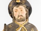 a statue of a man with a beard and a hat