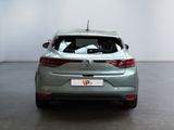 the rear end of a silver car in a white room