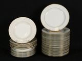 several plates stacked on top of each other on a black surface
