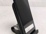 a cell phone that is sitting on a stand
