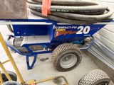 a blue cart with a hose on top of it