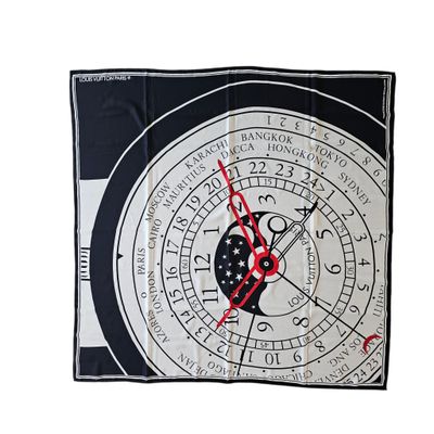 a black and white clock with red hands on a white background