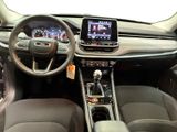 the interior of a car with a steering wheel, dashboard, and a touch screen