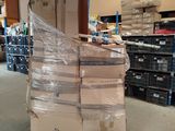 a large pile of boxes sitting on a pallet in a warehouse