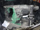 an image of a drill and other tools in a box
