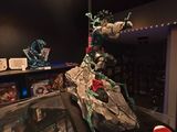 a display case with a statue of a dragon on it