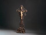 statue of jesus on the cross on a black background