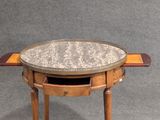 an image of a small table with a marble top