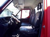 a red truck with black seats and a steering wheel