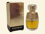 an image of a bottle of perfume sitting next to a box