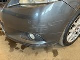 a close up of a car that is in a garage