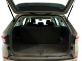 the back of a car with its trunk open and the back seats folded down