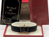 an image of a watch in a box with a book in the background