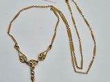 a close up of a necklace with a chain and a tag on it