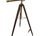 an antique brass telescope on a tripod stand