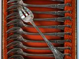 a box with a bunch of forks inside of it