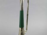 silver trumpet with green handle on a white background