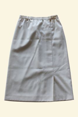 a white skirt with a zipper on the front and side