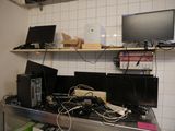 a desk with a bunch of electronics on top of it