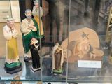 many figurines in a glass case on display