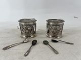 pair of antique silverplated salt and pepper shakers with spoons