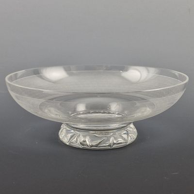 clear glass bowl sitting on top of a metal stand