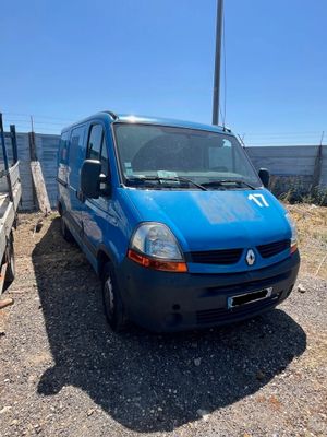 a blue van that is parked on the side of the road