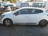 a white car parked in a lot with other cars in the background