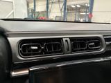 a car dashboard with a radio in the middle of it