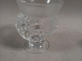 a clear glass vase with a flower inside of it
