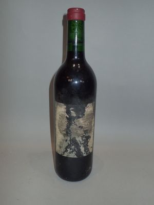 a bottle of wine that is sitting on a table