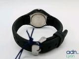 a close up of a wrist watch on a white surface