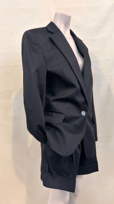 a mannequin wearing a suit and tie on a mannequin mannequin