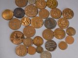 a pile of coins on a table with a white background