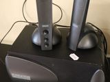 two speakers sitting on top of a speaker box